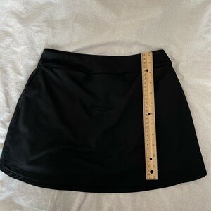 DSG girls performance skort black. Size L. 2 small front pockets. Worn 3 times